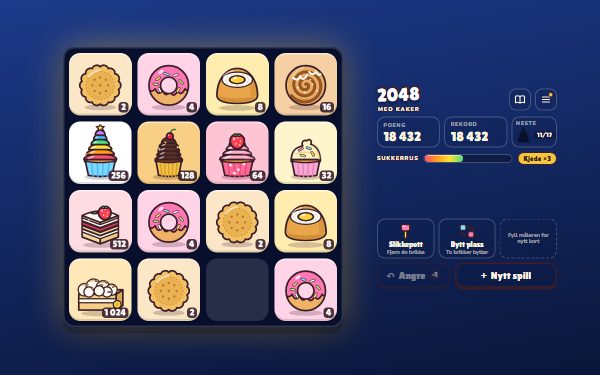 2048 med kaker: brettet med cupcakes, bløtkakestykket og Verdens beste, med poengtavlene ved siden av